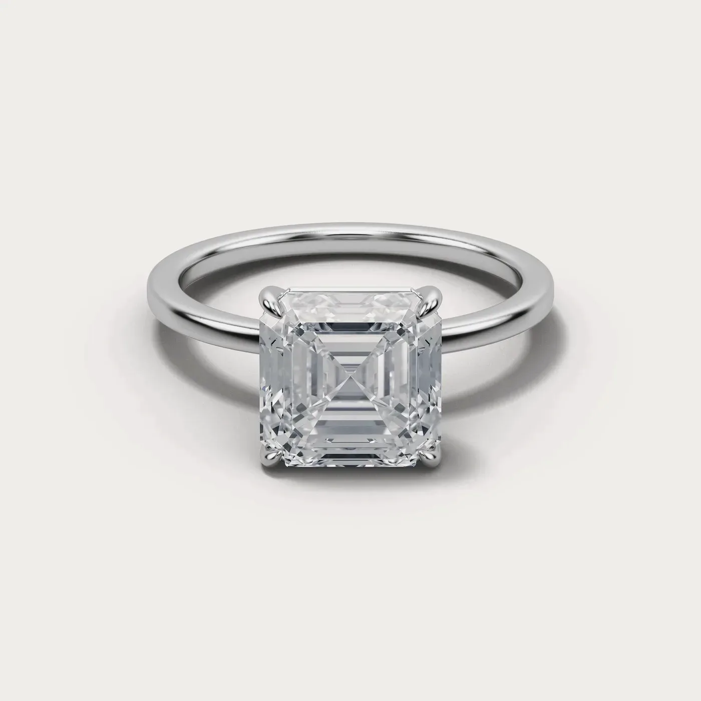 A asscher cut diamond in the same white gold solitaire, seen from directly above