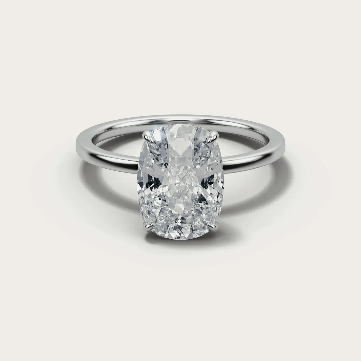 A cushion cut diamond in the same white gold solitaire, seen from directly above
