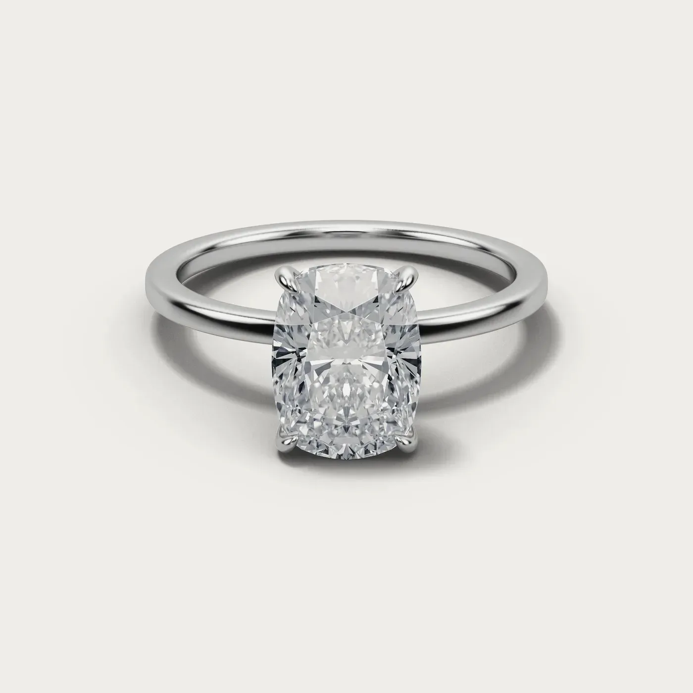 A elongated cushion cut diamond in the same white gold solitaire, seen from directly above
