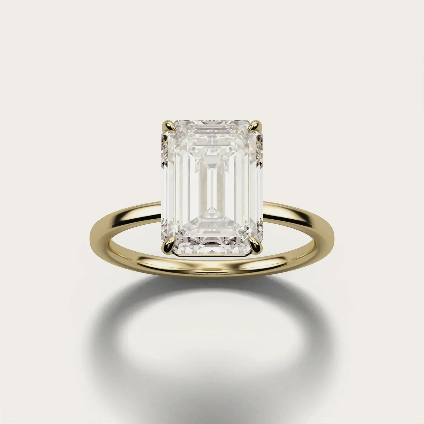 Classic Solitaire, emerald in yellow gold