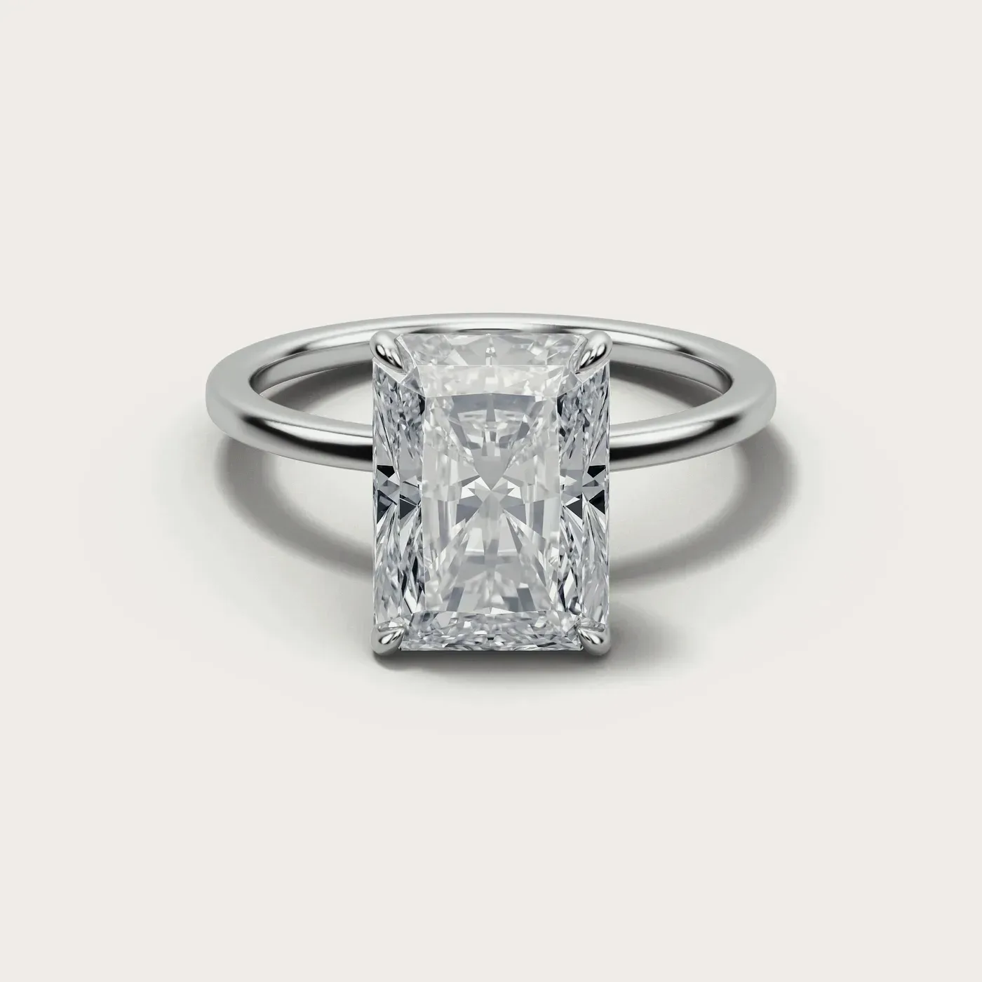 A radiant cut diamond in the same white gold solitaire, seen from directly above