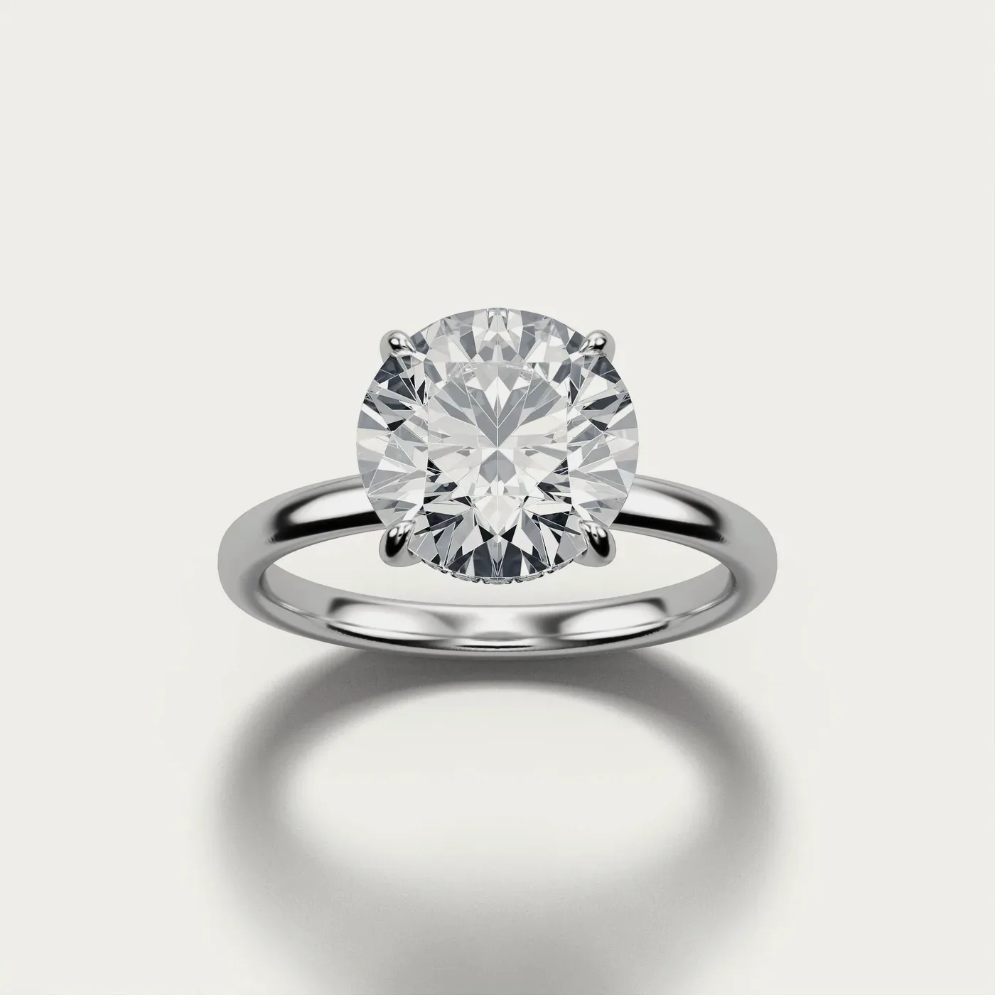 Hidden Halo, round in white gold, three-quarter view